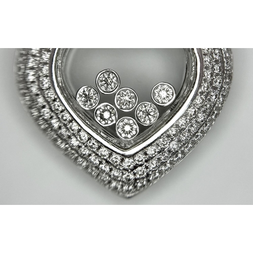 149 - A Beautiful 18K White Gold Diamond Encrusted Heart Pendant. Round and baguette cut diamonds with sev... 