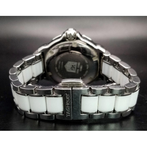 156 - A Tag Heuer Formula 1 Quartz Ladies Watch. Ceramic and steel bracelet and case - 35mm. White dial. N... 