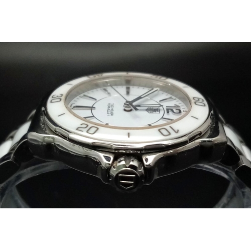 156 - A Tag Heuer Formula 1 Quartz Ladies Watch. Ceramic and steel bracelet and case - 35mm. White dial. N... 