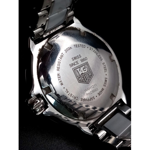 156 - A Tag Heuer Formula 1 Quartz Ladies Watch. Ceramic and steel bracelet and case - 35mm. White dial. N... 