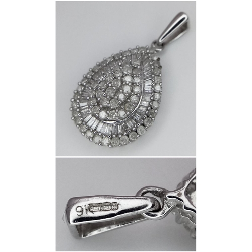 163 - A 9k White Gold and Diamond Jewellery Suite. Marquise shaped ring - size M. Oval pendant - 2.5cm. A ... 