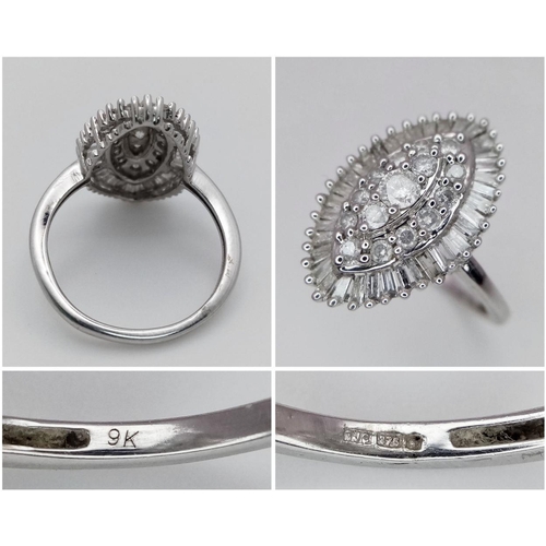 163 - A 9k White Gold and Diamond Jewellery Suite. Marquise shaped ring - size M. Oval pendant - 2.5cm. A ... 