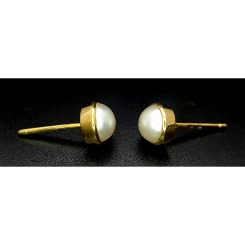 239 - A 18K Yellow Gold Pearl Studs (need backs) 2.6g total weight.

ref: 1266I