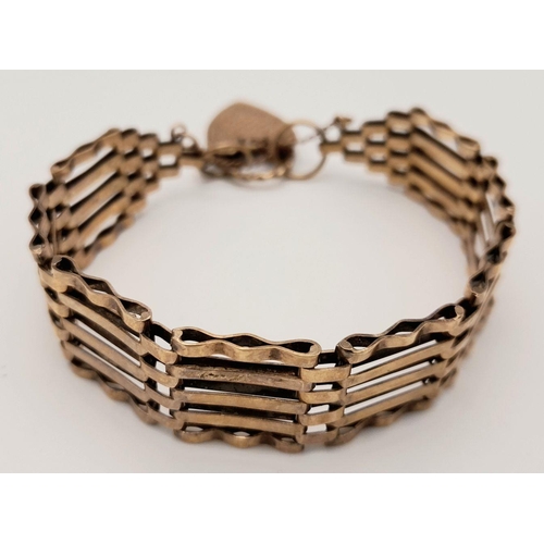 28 - Vintage 9 carat GOLD GATE BRACELET. Complete with gold safety chain. Beautifully decorated 9 carat G... 