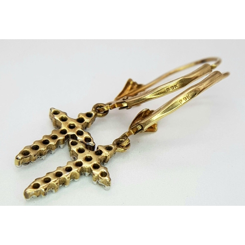 366 - A Pair of 9K Gold Diamond Cross Earrings. Leverback clasp. 17mm drop. Ref: 018138. 1.3g total weight... 