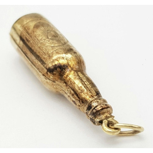 84 - 9 carat GOLD ‘BOTTLE of GUINNESS’ CHARM. 1.3 grams. 3 cm.