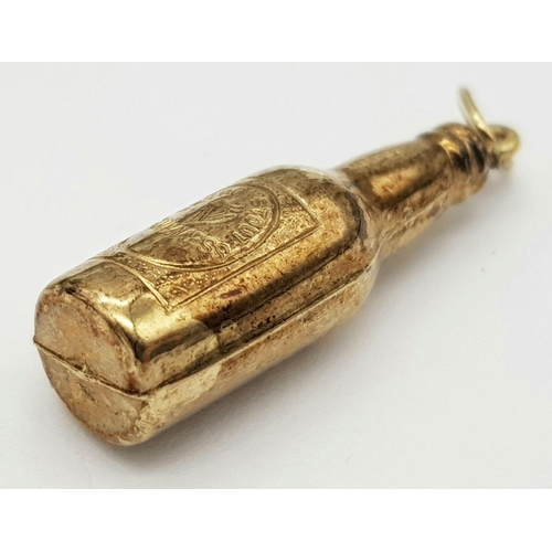 84 - 9 carat GOLD ‘BOTTLE of GUINNESS’ CHARM. 1.3 grams. 3 cm.