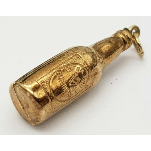 84 - 9 carat GOLD ‘BOTTLE of GUINNESS’ CHARM. 1.3 grams. 3 cm.