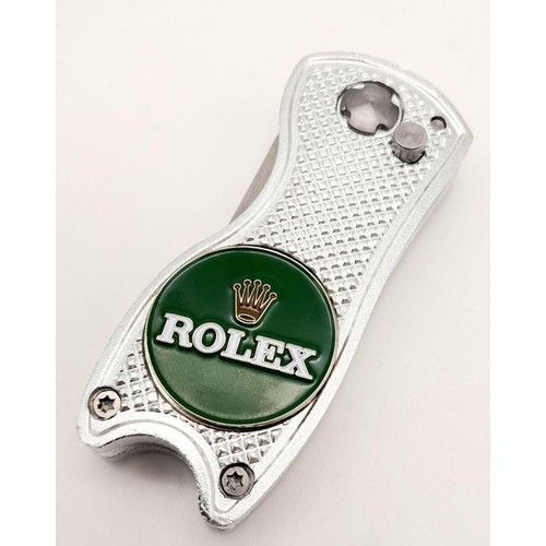 485 - A Rolex Branded Flick Golf Putting Repair Green Tool. Comes with a spare Rolex branded ball marker. ... 