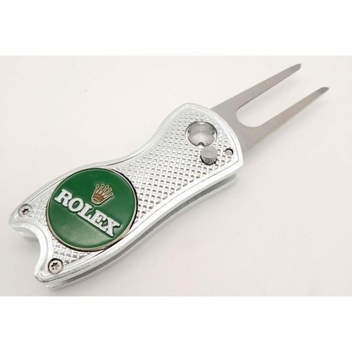 485 - A Rolex Branded Flick Golf Putting Repair Green Tool. Comes with a spare Rolex branded ball marker. ... 