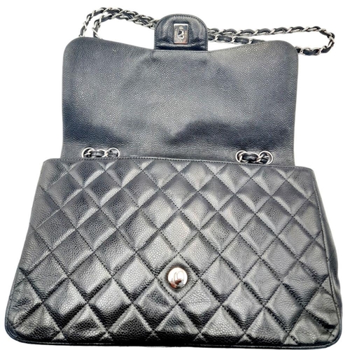 115 - A Chanel Black Classic Jumbo Single Flap Bag. Quilted leather exterior with silver-toned hardware, c... 