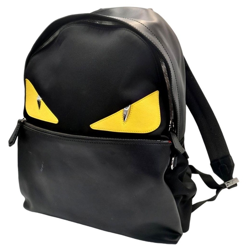 333 - A Fendi Black Monster Backpack. Textile and leather exterior, with two large yellow monster eyes, a ... 