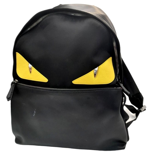 333 - A Fendi Black Monster Backpack. Textile and leather exterior, with two large yellow monster eyes, a ... 