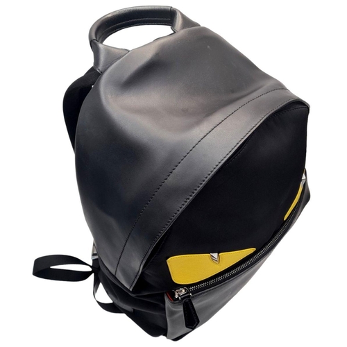 333 - A Fendi Black Monster Backpack. Textile and leather exterior, with two large yellow monster eyes, a ... 