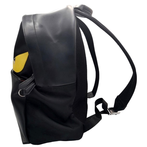 333 - A Fendi Black Monster Backpack. Textile and leather exterior, with two large yellow monster eyes, a ... 