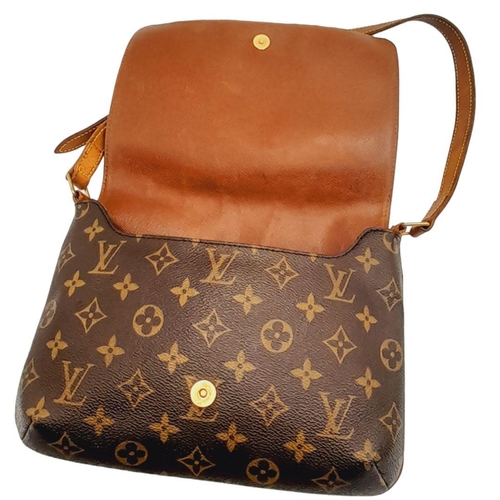 396 - A Louis Vuitton Musette Tango Bag. Monogram coated canvas exterior with leather trim, adjustable str... 