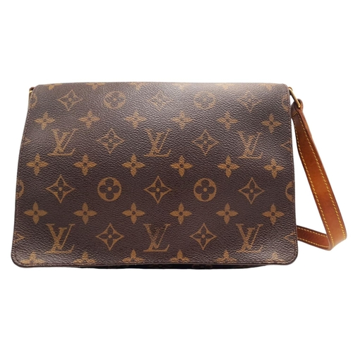 396 - A Louis Vuitton Musette Tango Bag. Monogram coated canvas exterior with leather trim, adjustable str... 