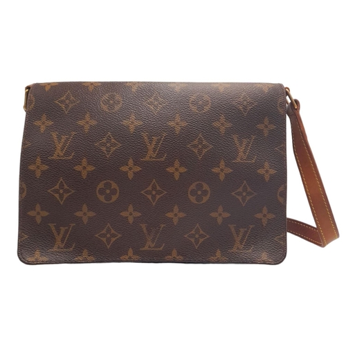 396 - A Louis Vuitton Musette Tango Bag. Monogram coated canvas exterior with leather trim, adjustable str... 