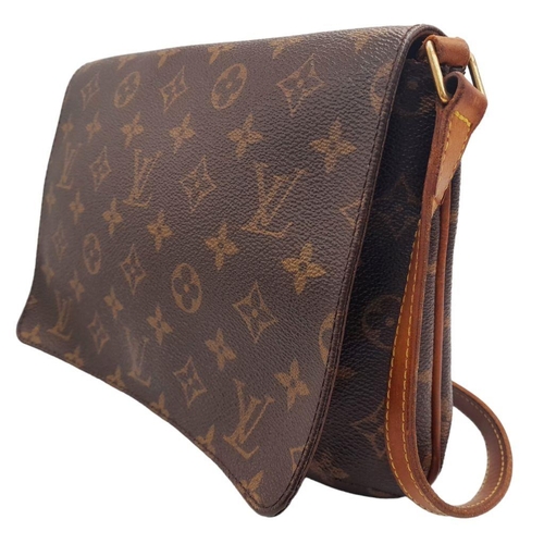 396 - A Louis Vuitton Musette Tango Bag. Monogram coated canvas exterior with leather trim, adjustable str... 