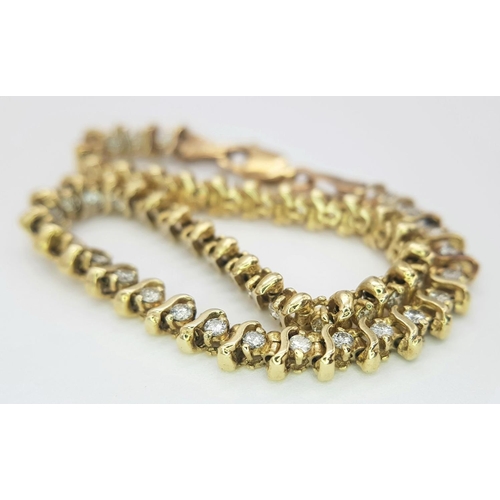 185 - A 9K Yellow Gold Diamond Tennis Bracelet. 50 small round cut diamonds. 18cm. 8.6g total weight. Ref:... 