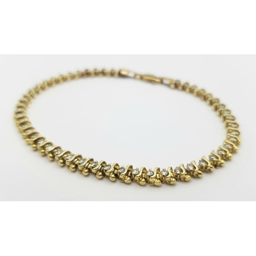 185 - A 9K Yellow Gold Diamond Tennis Bracelet. 50 small round cut diamonds. 18cm. 8.6g total weight. Ref:... 