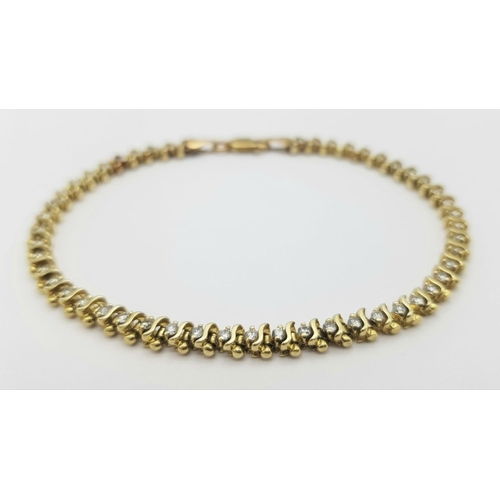 185 - A 9K Yellow Gold Diamond Tennis Bracelet. 50 small round cut diamonds. 18cm. 8.6g total weight. Ref:... 