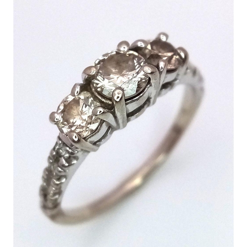 22 - A 10K White Gold Three Stone Diamond Ring. 0.8ctw approx. 
Size K. 2.2g total weight. Ref: 017993