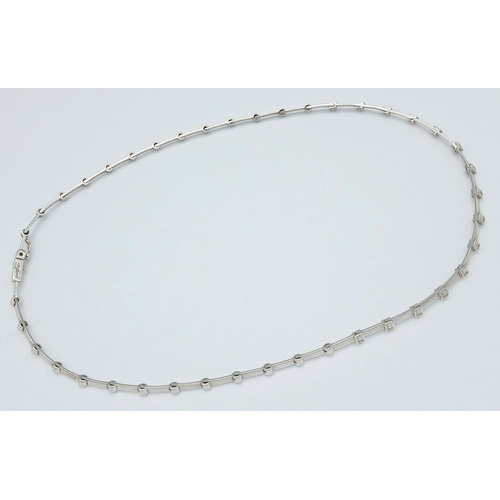 260 - An 18K White Gold Diamond Choker Necklace. 15 round cut diamonds. 17g total weight. 40cm. Ref: 01812... 