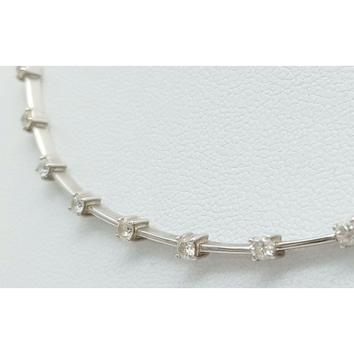 260 - An 18K White Gold Diamond Choker Necklace. 15 round cut diamonds. 17g total weight. 40cm. Ref: 01812... 