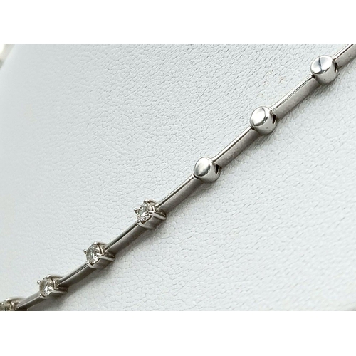 260 - An 18K White Gold Diamond Choker Necklace. 15 round cut diamonds. 17g total weight. 40cm. Ref: 01812... 