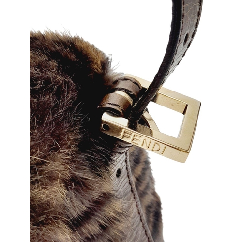 410 - A Fendi Brown Striped Fur Baguette Shoulder Bag. Faux fur exterior with magnetic closure and leather... 