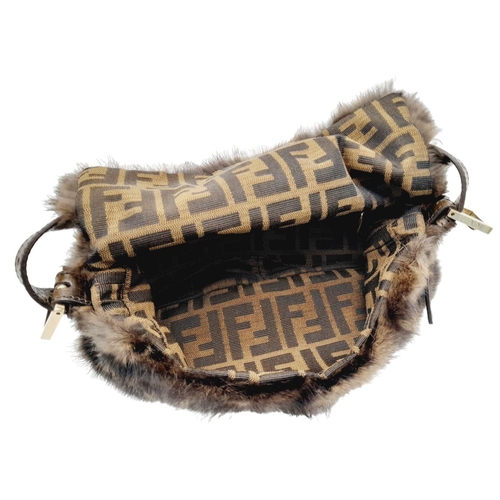 410 - A Fendi Brown Striped Fur Baguette Shoulder Bag. Faux fur exterior with magnetic closure and leather... 