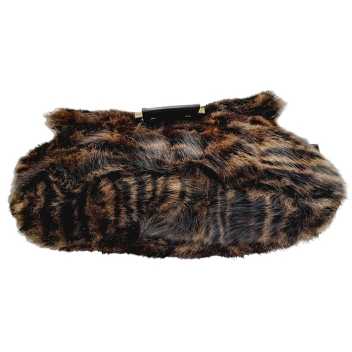 410 - A Fendi Brown Striped Fur Baguette Shoulder Bag. Faux fur exterior with magnetic closure and leather... 