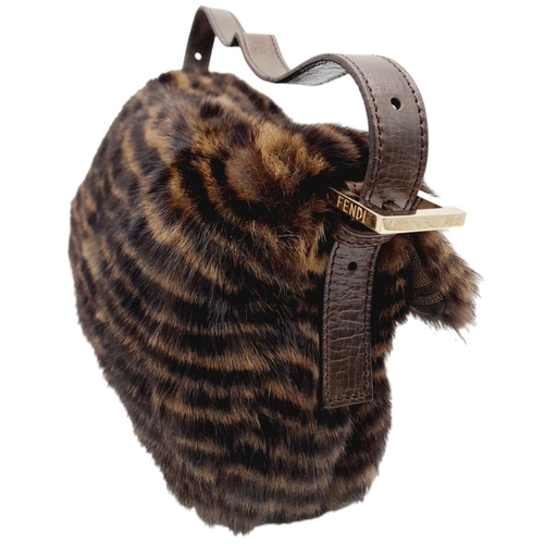 410 - A Fendi Brown Striped Fur Baguette Shoulder Bag. Faux fur exterior with magnetic closure and leather... 