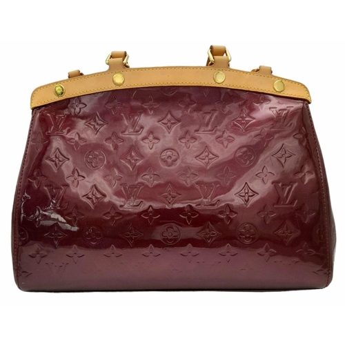 424 - A Louis Vuitton Burgundy Vernis Brea MM Bag. Monogram patent leather exterior with gold-toned hardwa... 