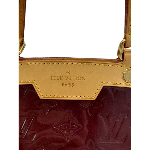 424 - A Louis Vuitton Burgundy Vernis Brea MM Bag. Monogram patent leather exterior with gold-toned hardwa... 