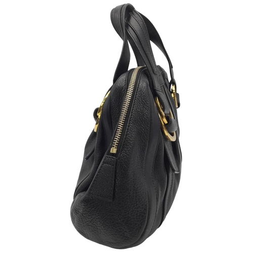 431 - A Bvlgari Black Polly Handbag. Black leather exterior with gold-toned hardware with two leather stra... 