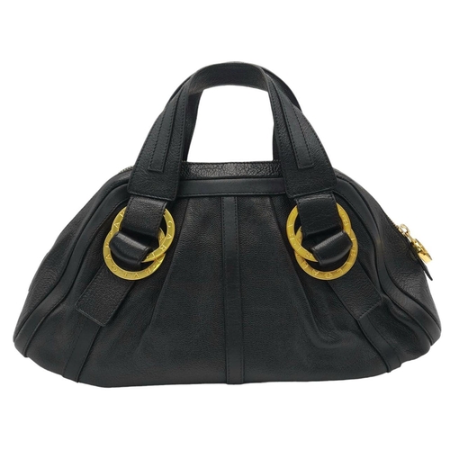 431 - A Bvlgari Black Polly Handbag. Black leather exterior with gold-toned hardware with two leather stra... 