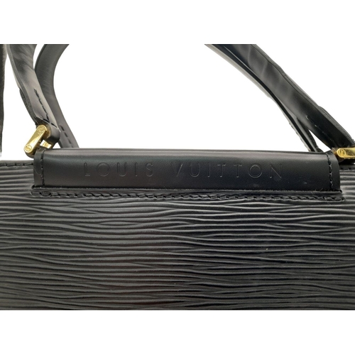 438 - A Louis Vuitton Black Figari PM Handbag. Epi leather exterior with gold-toned hardware, two handles,... 