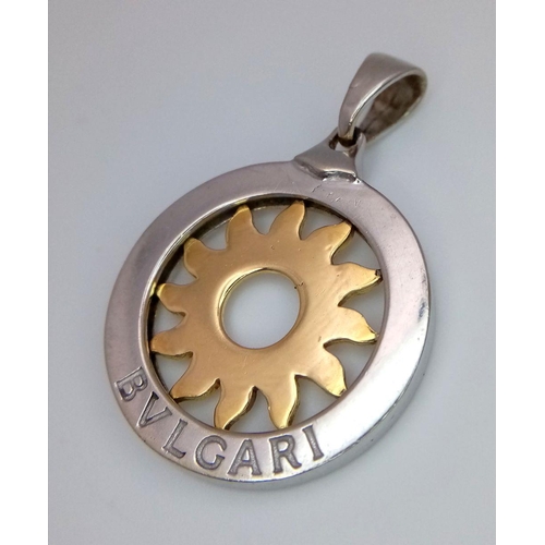 44 - A Bulgari 18K White and Yellow Gold Sun Pendant. 26mm diameter. 8.57g. Ref: 018124