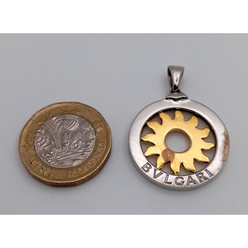 44 - A Bulgari 18K White and Yellow Gold Sun Pendant. 26mm diameter. 8.57g. Ref: 018124