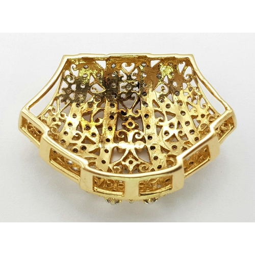 464 - A Majestic 14K Yellow Gold Diamond Encrusted Pendant. Pierced decoration with symmetrical diamond pl... 