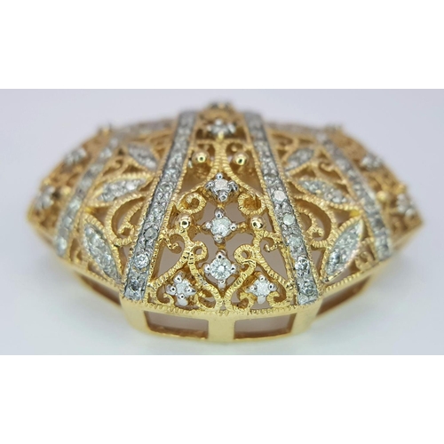 464 - A Majestic 14K Yellow Gold Diamond Encrusted Pendant. Pierced decoration with symmetrical diamond pl... 