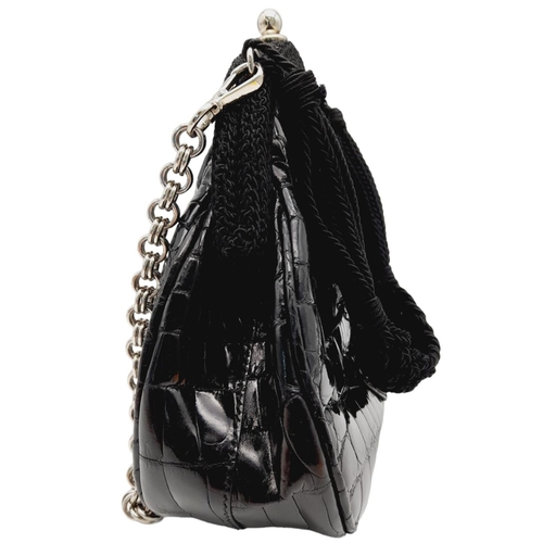 249 - A Prada Black Coccodrillo Evening Bag. Crocodile leather exterior with silver-toned hardware, textil... 