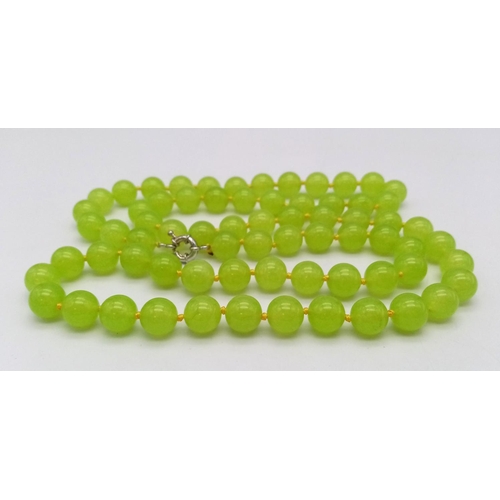 292 - A Lovely Summer Matinee Length Apple Coloured Peridot Necklace. 90cm length with 12mm beads.