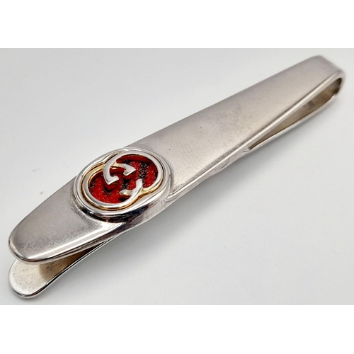 106 - A Vintage Gucci Tie Clip. White metal with Gucci monogram. Fitted Gucci case and COA.