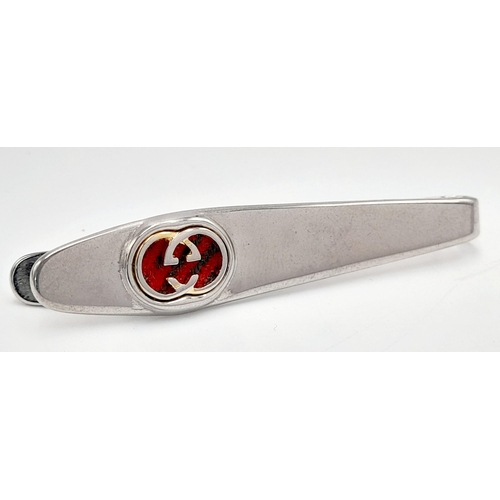 106 - A Vintage Gucci Tie Clip. White metal with Gucci monogram. Fitted Gucci case and COA.