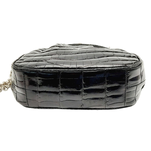 249 - A Prada Black Coccodrillo Evening Bag. Crocodile leather exterior with silver-toned hardware, textil... 