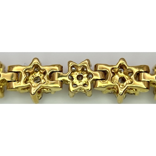 267 - An 18K Yellow Gold Diamond Tennis Bracelet. Floral form with 154 round cut diamonds - 4.18ctw. 16cm.... 