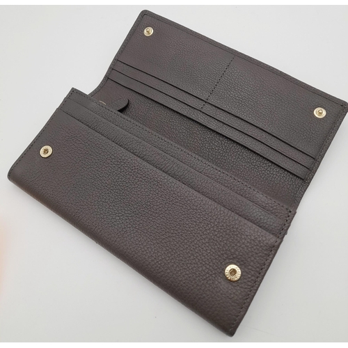 354 - A Mulberry Khaki Continental Wallet. Leather exterior with a zipped compartment to back and double p... 